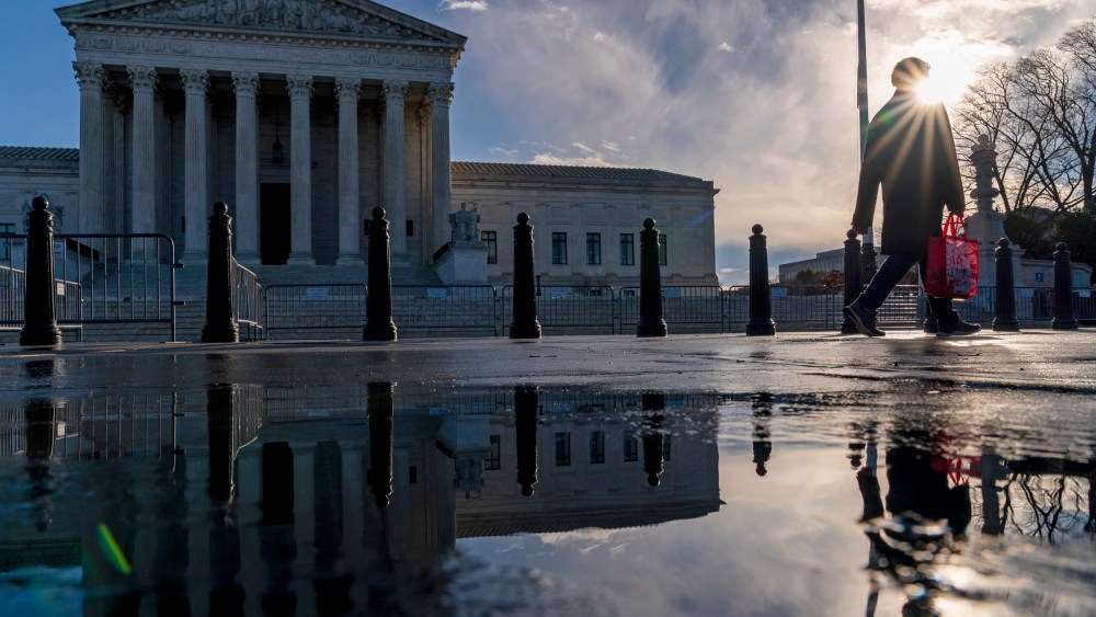 A pedestrian passes the Supreme Court in Washington on Jan. 23, 2023.