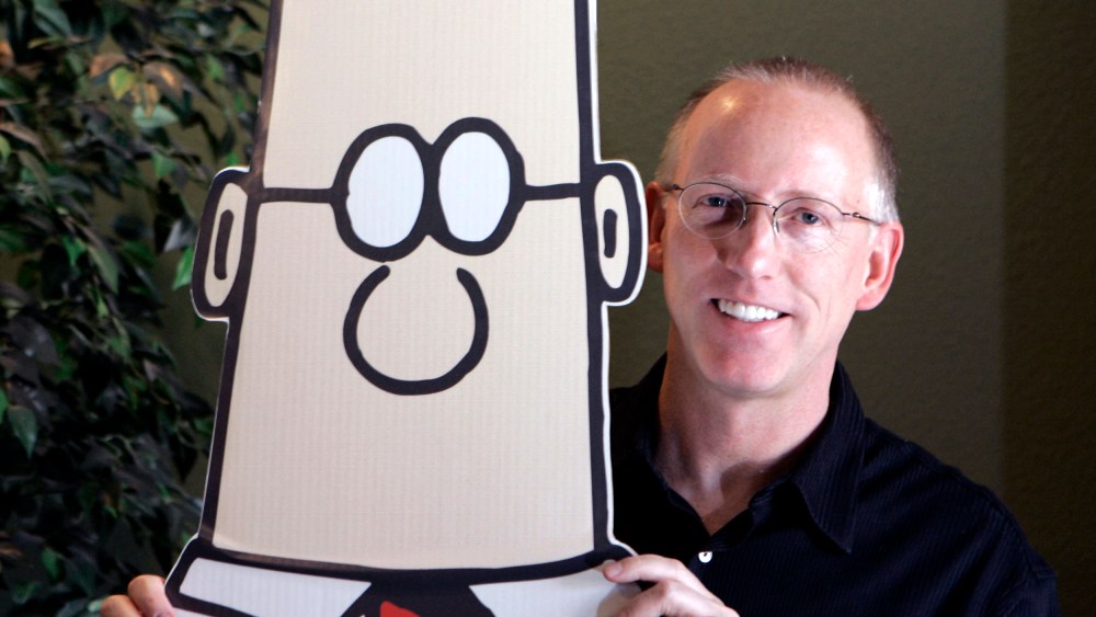 Scott Adams with a cutout of Dilbert in his studio in Dublin, Calif.,