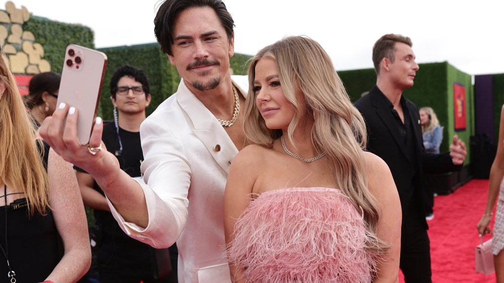 Tom Sandoval and Ariana Madix take a selfie on the red carpet at the MTV Movie & TV Awards
