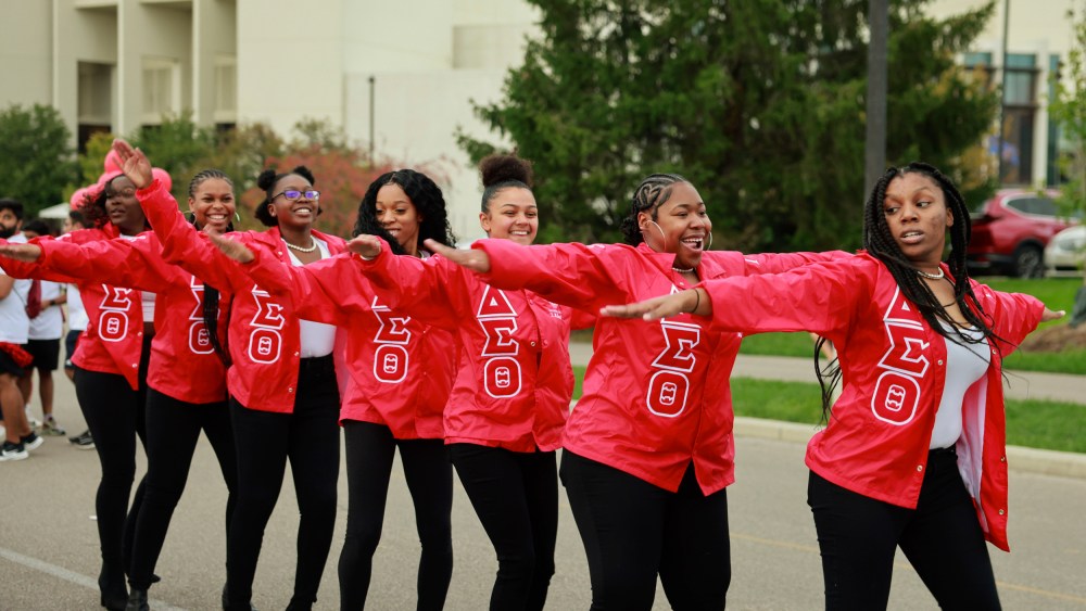 Members of Delta Sigma Theta sorority dance during the Indiana University Homecoming Parade in Bloomington, Ind.