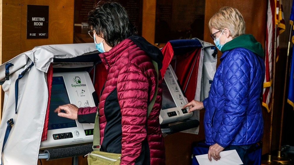 Image: Residents cast their votes at the Warner Park Community Recreation Center on the first day of early voting on March 21, 2023, in Madison, Wis.