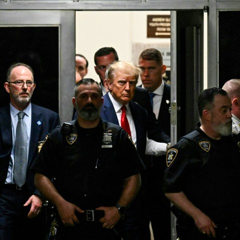 Former President Donald Trump makes his way inside the Manhattan Criminal Courthouse in New York on April 4, 2023.