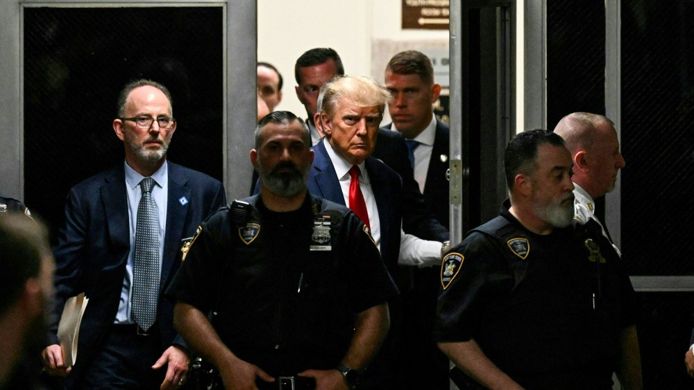 Former President Donald Trump makes his way inside the Manhattan Criminal Courthouse in New York on April 4, 2023.