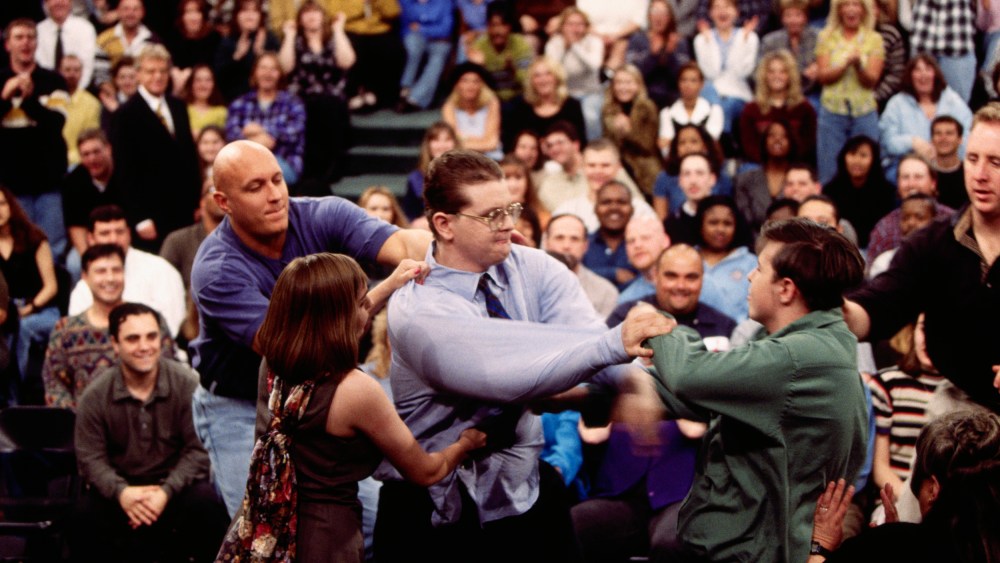 Security guard Steve Wilkos, left, tries to separate fighting guests on The Jerry Springer Show. The show's topic was "I Am Pregnant By Half-Brother."