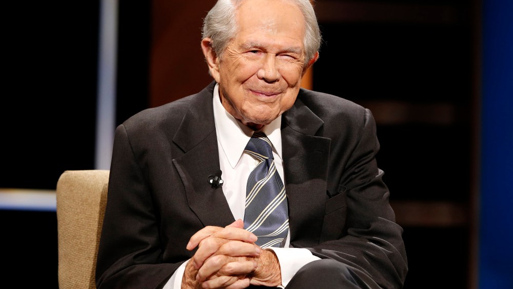 FILE - Rev. Pat Robertson poses a question to a Republican presidential candidate during a forum at Regent University in Virginia Beach, Va., Oct. 23, 2015. Robertson, a religious broadcaster who turned a tiny Virginia station into the global Christian Broadcasting Network, tried a run for president and helped make religion central to Republican Party politics in America through his Christian Coalition, has died. He was 93. Robertson's death Thursday, June 8, 2023 was announced by his broadcasting network. (AP Photo/Steve Helber, File)
