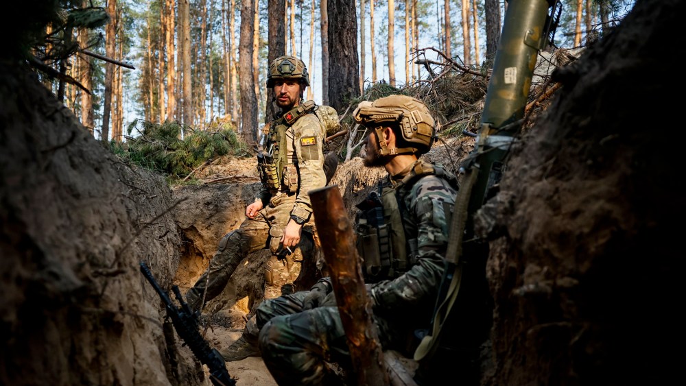 Ukrainian soldiers rest in a trench on the frontline near Kreminna, Luhansk region, on June 8, 2023.