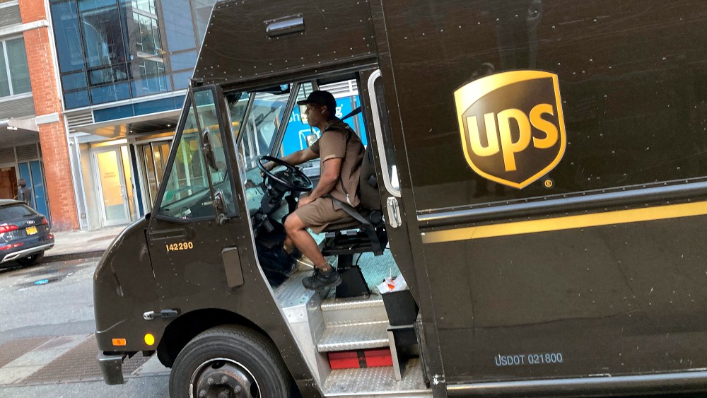 A United Parcel Service driver pilots his truck, in New York, Thursday, May 11, 2023. More than 340,000 unionized United Parcel Service employees, including drivers and warehouse workers, say they are prepared to strike if the company does not meet their demands before the end of the current contract on July 31. UPS