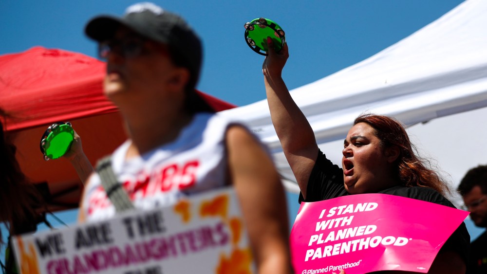 Demonstrators call for reproductive freedom at a rally