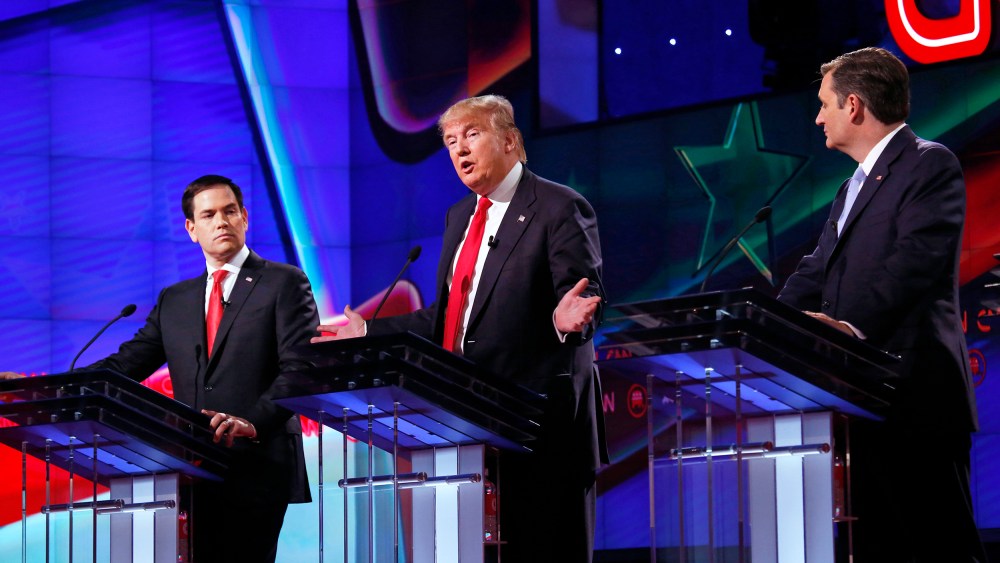 Donald Trump speaks during a Republican primary debate alongside Sen. Marco Rubio and Sen. Ted Cruz