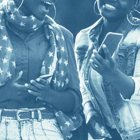 Young Black  women with their smart phones