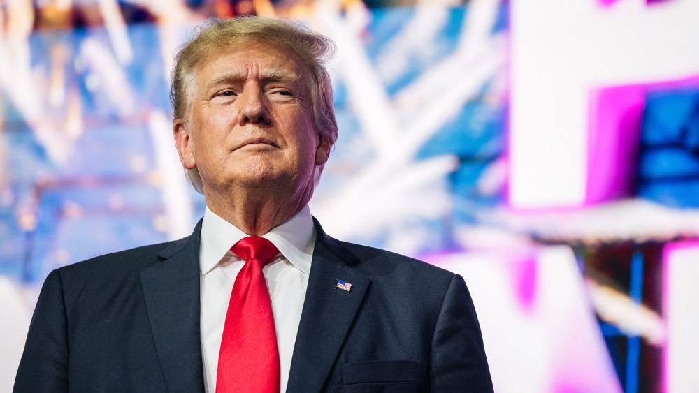 PHOENIX, ARIZONA - JULY 24: Former U.S. President Donald Trump  makes an entrance at the Rally To Protect Our Elections conference on July 24, 2021 in Phoenix, Arizona. The Phoenix-based political organization Turning Point Action hosted former President Donald Trump alongside GOP Arizona candidates who have begun candidacy for government elected roles.