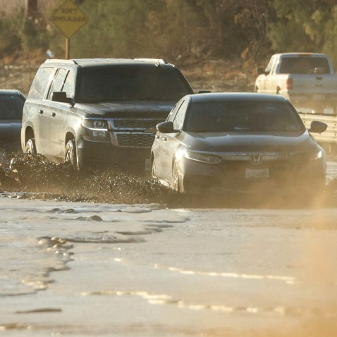 Traffic is slowed as water and mud from Tropical Storm Hilary covers part of Interstate 10 between Indio and Palm Springs, Calif., on Aug. 21, 2023.