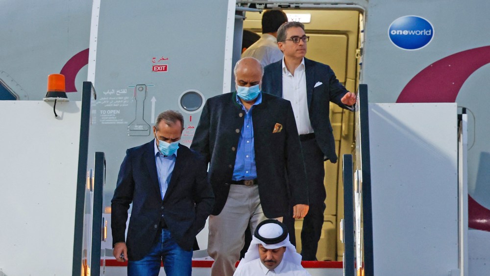 U.S. citizens Emad Sharqi, left, and Morad Tahbaz and Siamak Namazi disembark from a Qatari jet upon their arrival at the Doha International Airport on Sept.18, 2023.