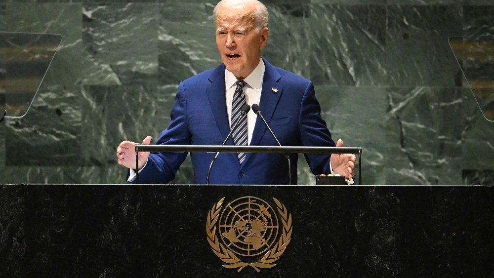 Joe Biden speaks at a podium with the United Nations logo in the front