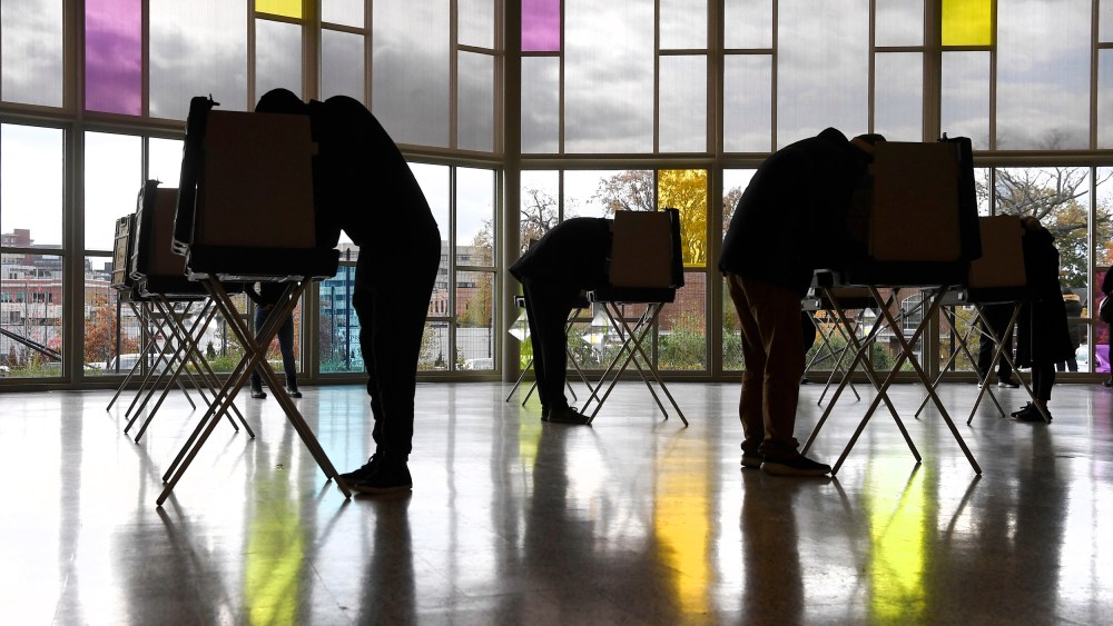 Voters mark their ballots at First Presbyterian Church in Stamford, Conn.