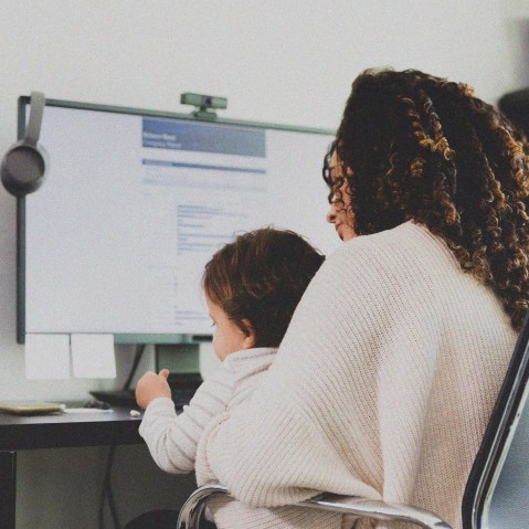 Mom cares for son while working.