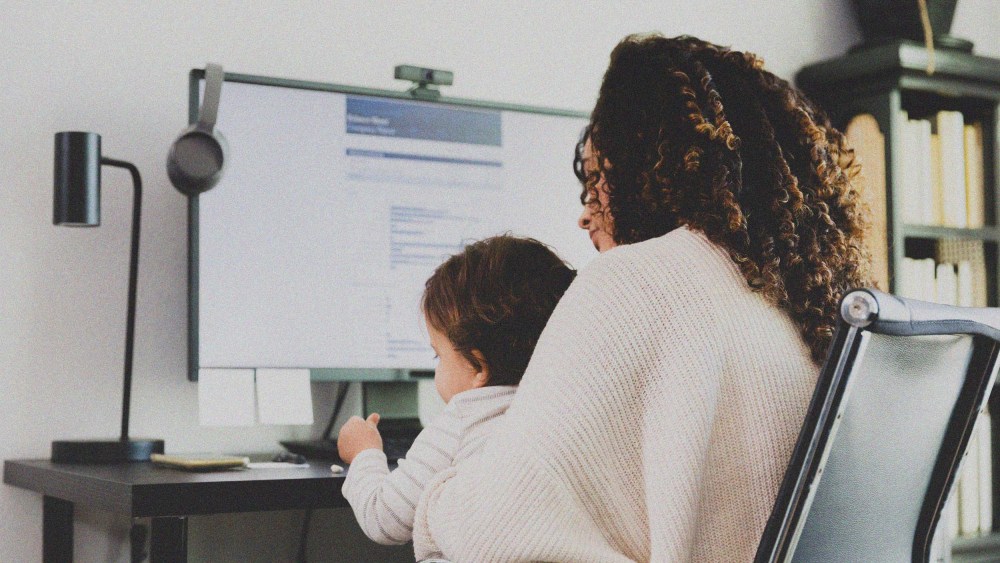Mom cares for son while working.