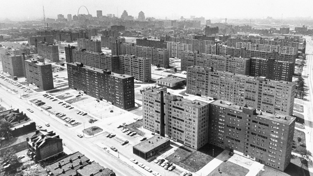 (Original Caption) St. Louis: Aerial view made June 5, 1971 shows the massive Pruitt-Igoe housing project with its busted windows and the St. Louis Gateway Arch in background. Most of the 35 buildings in the complex are vacant.