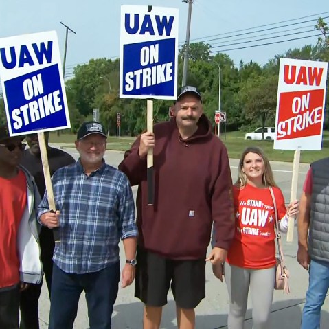 Sen. John Fetterman, D-Pa., walks the picket line in support of the UAW strike in Wayne, Mich.., on Sept. 17, 2023.