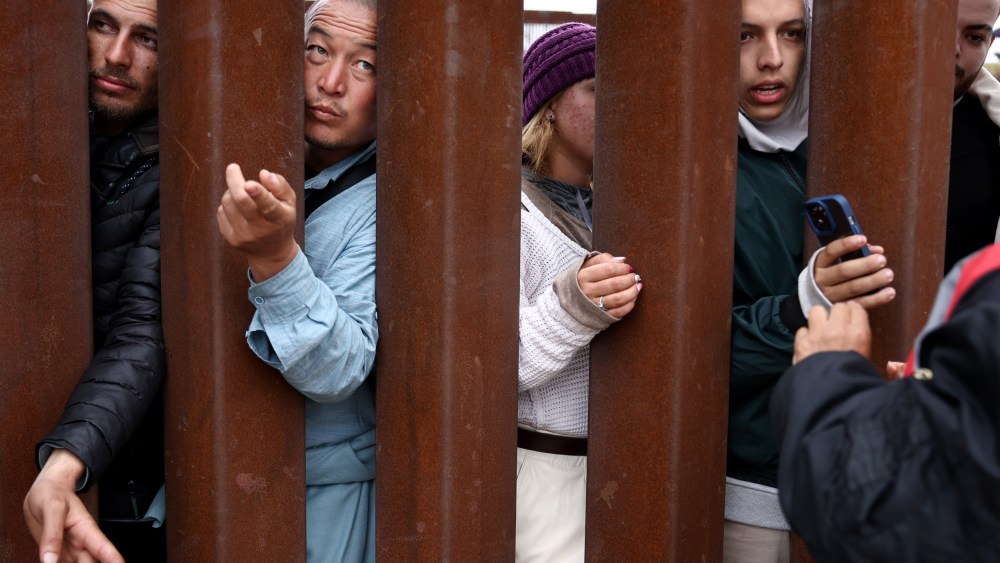Immigrants at the border wall