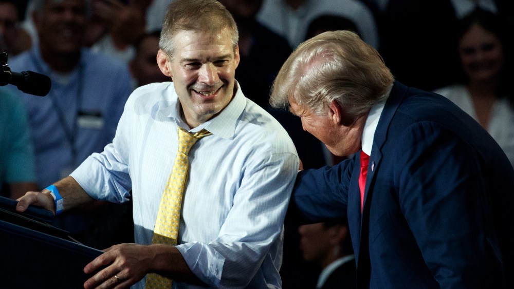 Rep. Jim Jordan, R-Ohio, looks to President Donald Trump as he speaks at a rally