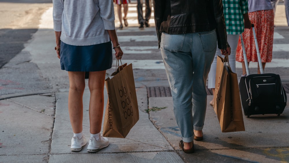 Shoppers carry Bloomingdale's bags in the Magnificent Mile shopping district in Chicago