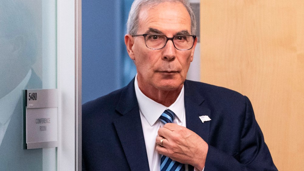 David Weiss leaves a conference room