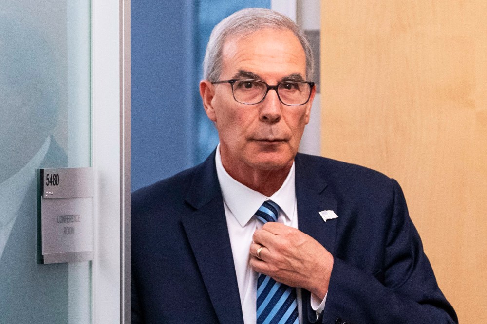 David Weiss leaves a conference room