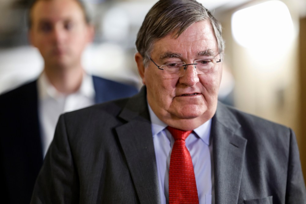 Rep. Michael Burgess, R-Texas, arrives at a Republican caucus meeting at the Capitol on Sept. 13, 2023.