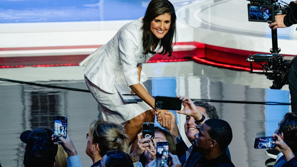 Former U.N. Ambassador Nikki Haley shakes hands and takes photos with attendees after the  Republican presidential debate in Miami.Image: