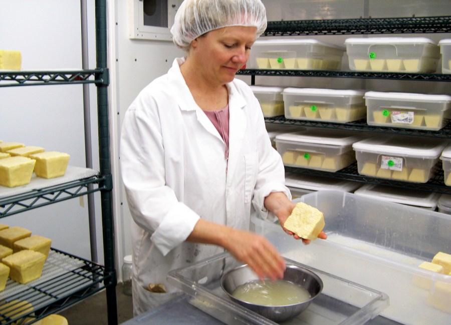 Karen Getz making cheese.