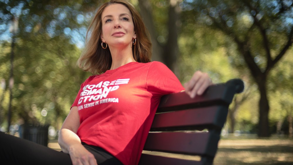 Shannon Watts sits on a park bench