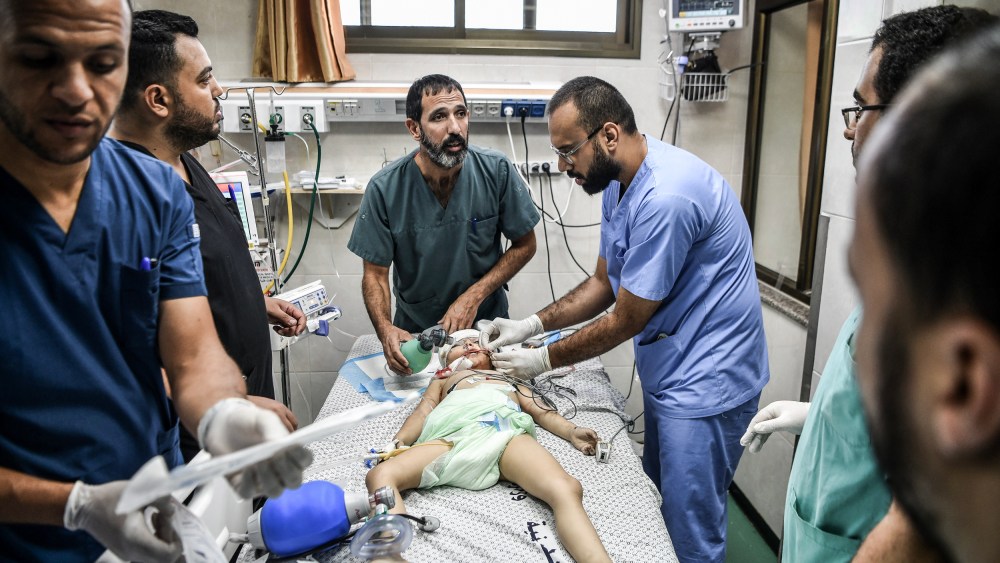 Doctors examine a child injured during an Israeli attack at Nasser Hospital in Khan Yunis, Gaza on Oct. 13, 2023.