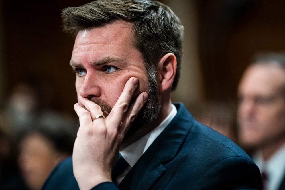 J.D. Vance listens during a hearing.