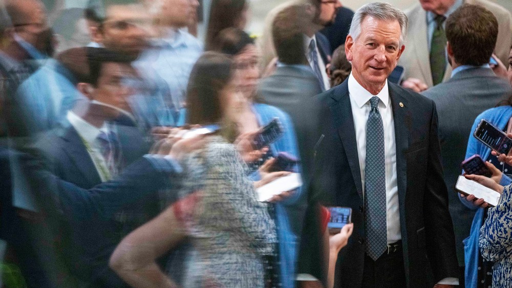 Sen. Tommy Tuberville, R-Ala., talks with reporters as he walks to a vote on Capitol Hill