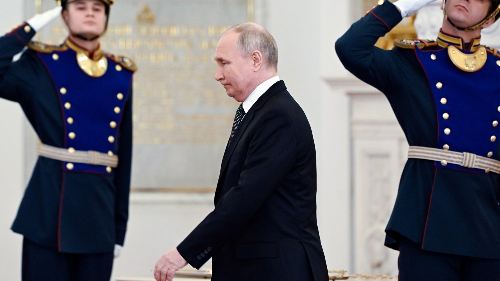 Russian President Vladimir Putin arrives to attend a ceremony to present Gold Star medals to Heroes of Russia