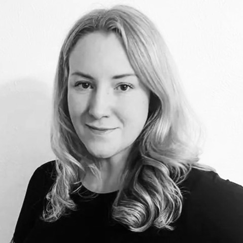 A black and white photo of Kate Cox.