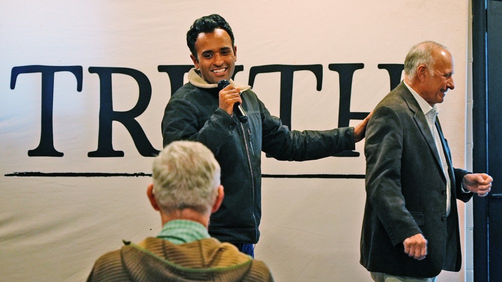 Republican presidential candidate Vivek Ramaswamy with former Rep. Steve King at an event in Iowa on Dec. 13, 2023.