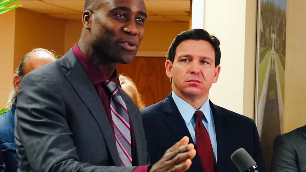 Joseph Ladapo and Ron DeSantis at a news conference in West Palm Beach, Fla.,