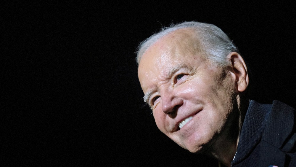 President Joe Biden stops to speak with members of the press as he walks from Marine One to the residence of the White House Dec. 20, 2023.