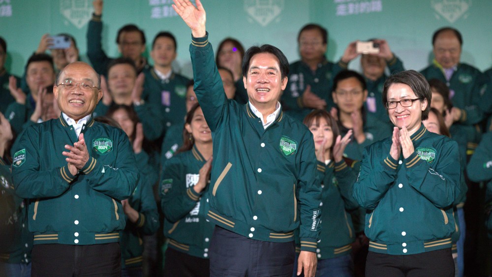 Taiwanese Vice President Lai Ching-te, also known as William Lai, center, celebrates his victory with running mate Bi-khim Hsiao, right, and supporters in Taipei, Taiwan on Jan. 13, 2024.
