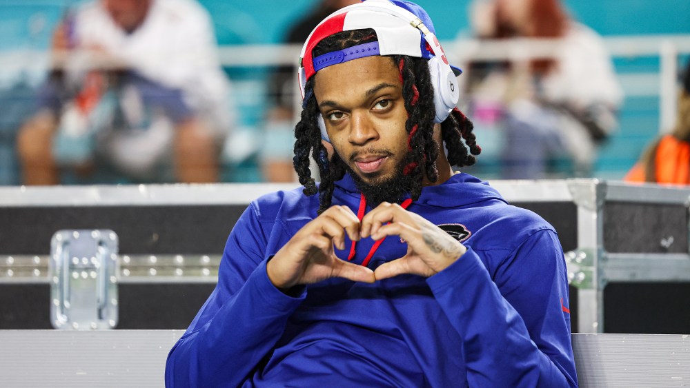 Damar Hamlin makes a heart-shaped-gesture with his hands