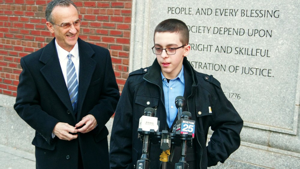 Middle schooler Liam Morrison speaks outside of the U.S. Court of Appeals for the First Circuit in Boston on Thursday morning, Feb. 8, 2024. His attorney, David Cortman, looks on.