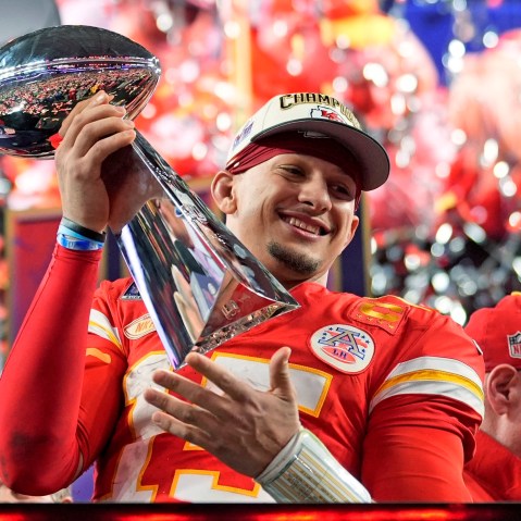 Kansas City Chiefs quarterback Patrick Mahomes celebrates with the trophy after the team's Super Bow win on Feb. 11, 2024, in Las Vegas.