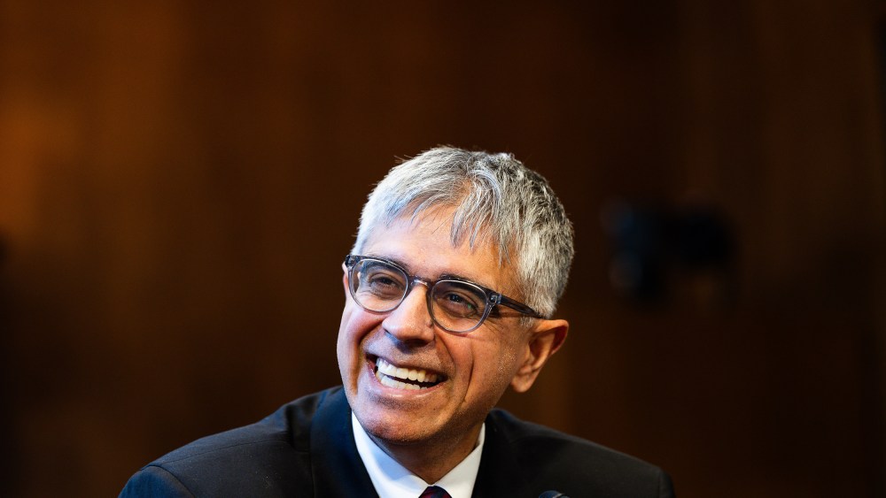 Adeel Mangi smiles during a nomination hearing.