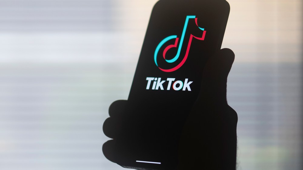 The TikTok logo on a mobile device.