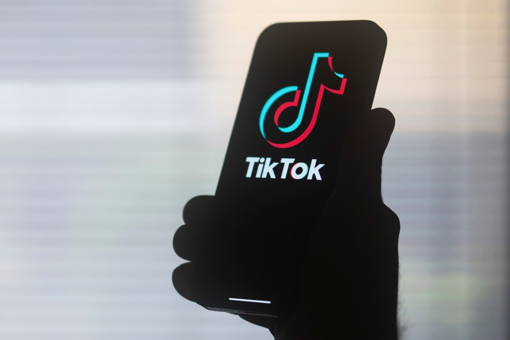 The TikTok logo on a mobile device.