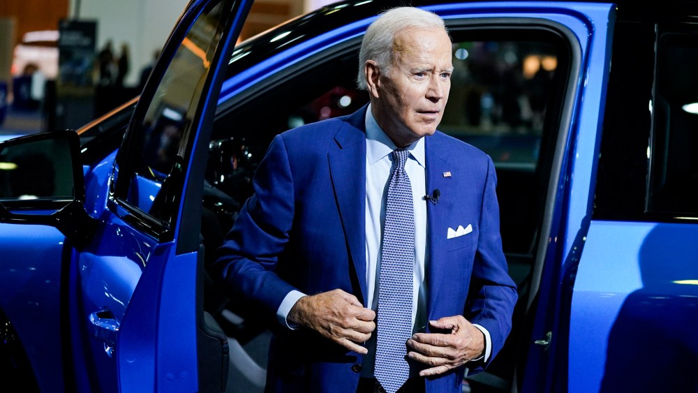 President Joe Biden gets out of a vehicle