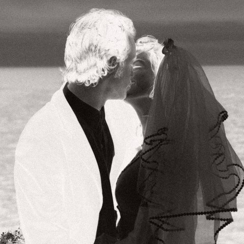 A bride and groom kissing
