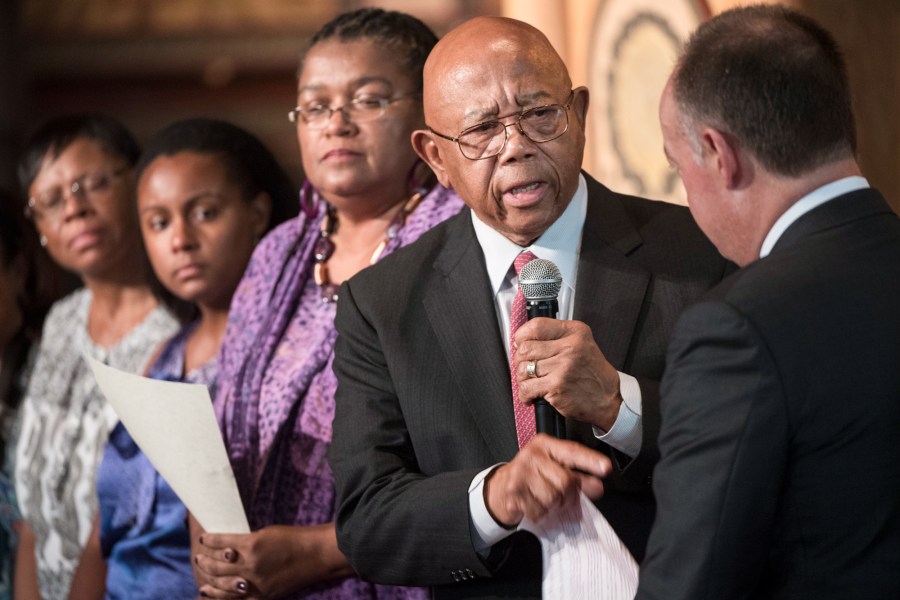 Slave descendant Joseph Stewart speaks to Georgetown University President John DeGioia